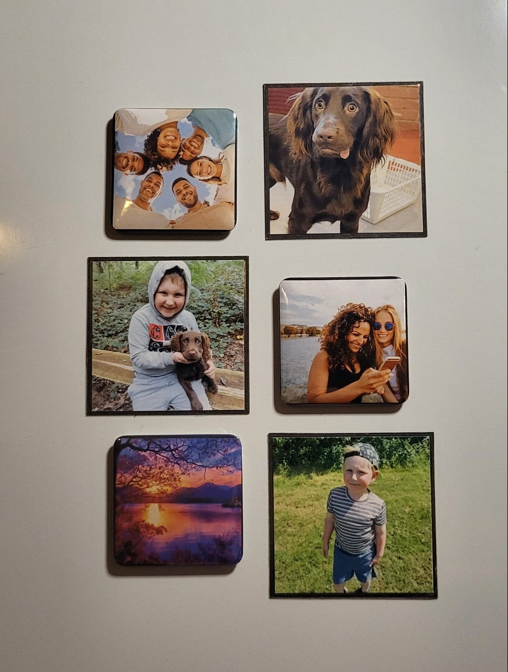 Collection of magnetic photos on a wall